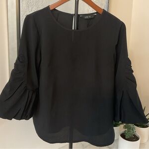 ***LOB ***Elegant Semi Sheer Blouse with Statement Sleeves .